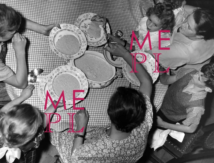 : Families eating stew : Families eating stew