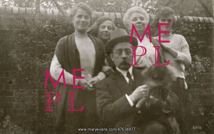 : Family group with dog in a garden : Family group with dog in a garden