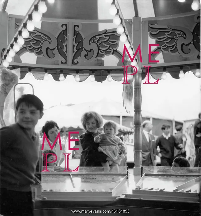 : Family group at a fairground stall : Family group at a fairground stall