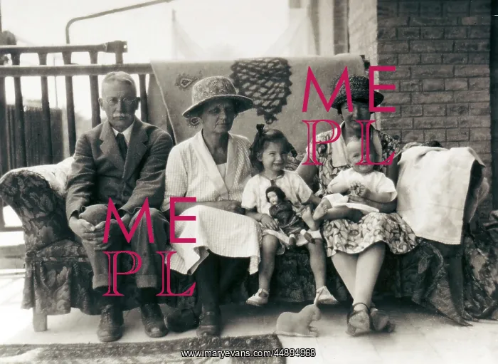 : Family group on a sofa on a verandah : Family group on a sofa on a verandah