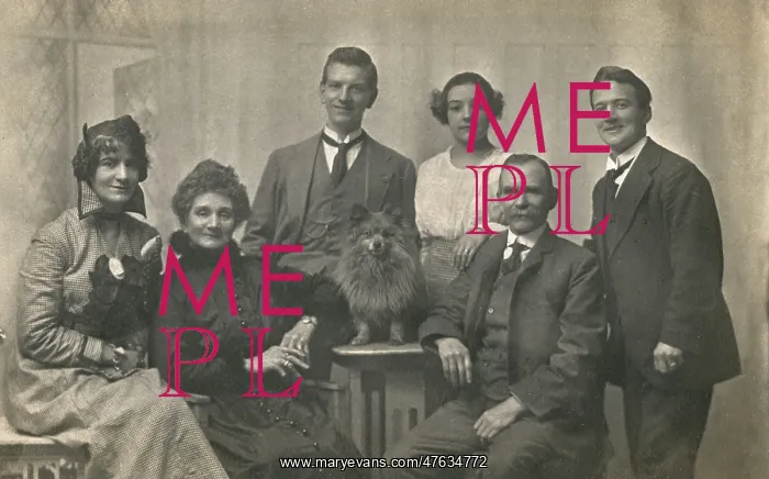 : Family group studio portrait with small dog : Family group studio portrait with small dog
