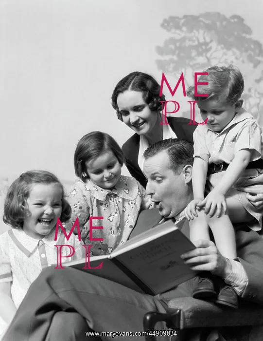 : Family of five grouped around father reading : Family of five grouped around father reading