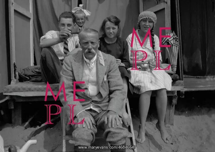 : Family on holiday in their beach hut : Family on holiday in their beach hut