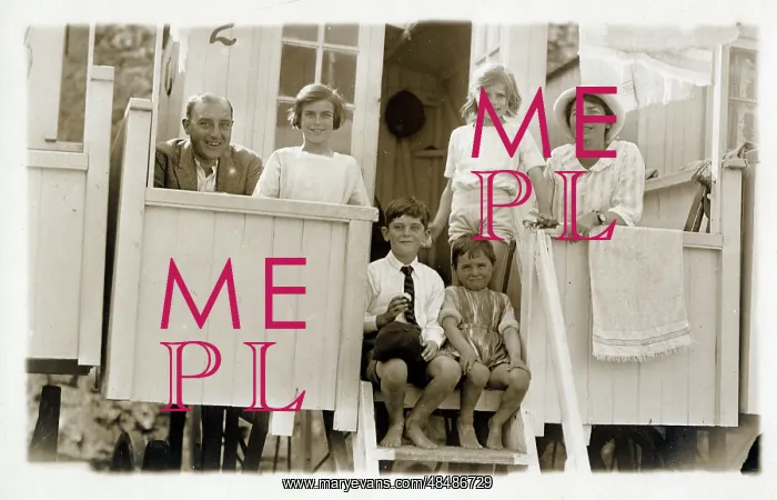 : Family outside their beach hut : Family outside their beach hut