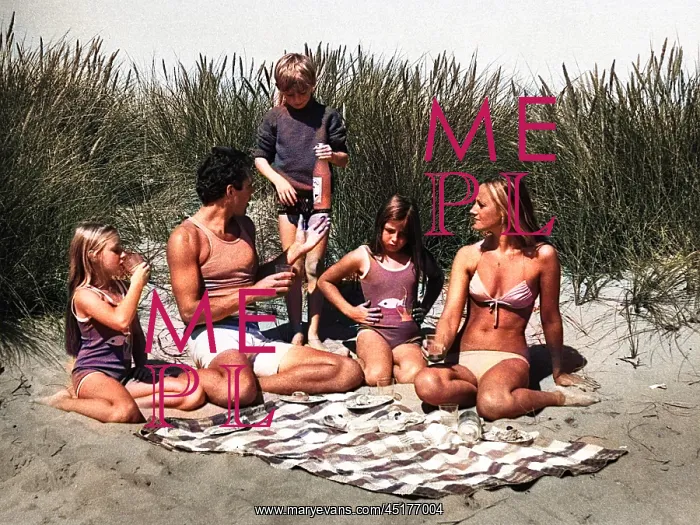 : Family of five with picnic on beach : Family of five with picnic on beach