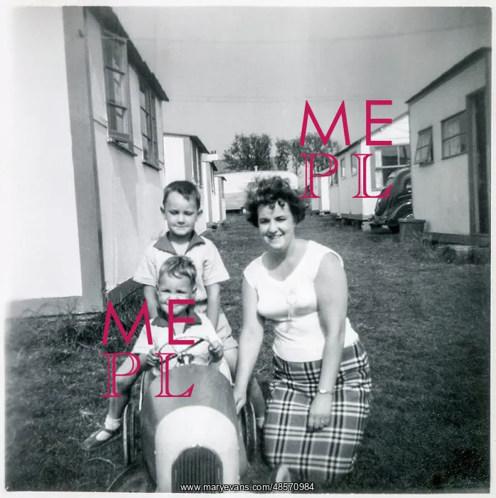 : Family pose for the camera at a British holiday camp : Family pose for the camera at a British holiday camp