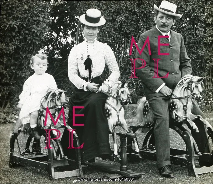  : Family on three rocking horses