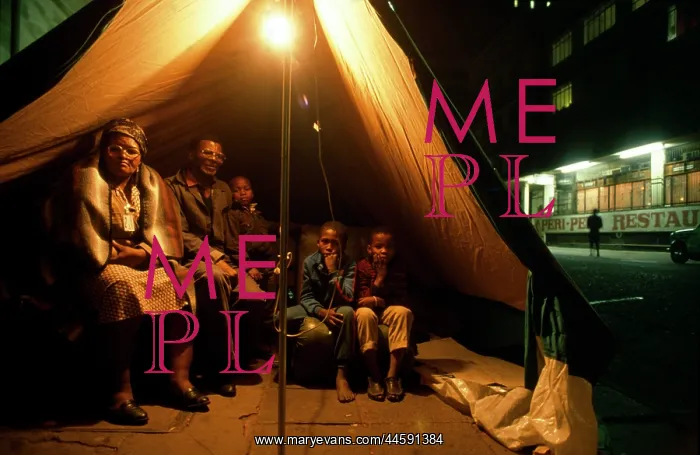 : Family sheltering in a tent. Some may have been : Family sheltering in a tent. Some may have been