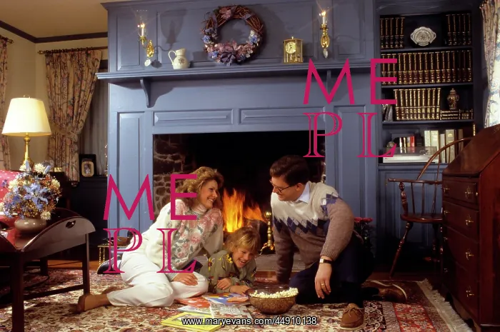 : Family sitting by fireplace