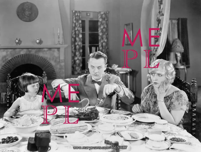 : Family of three sitting together having dinner : Family of three sitting together having dinner