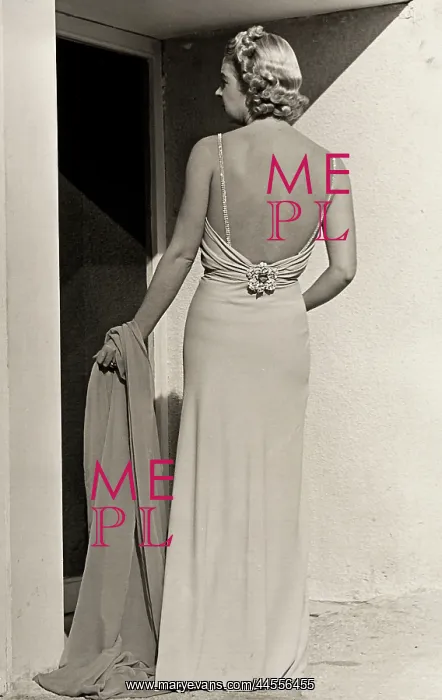 : Fashion. Model seen from the back wears evening dress from the couture house Fumach : Fashion. Model seen from the back wears evening dress from the couture house Fumach