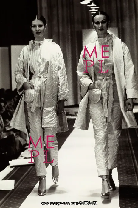 : Fashion show. Two models on the cat-walk wearing outfits by Rocco Barocco : Fashion show. Two models on the cat-walk wearing outfits by Rocco Barocco