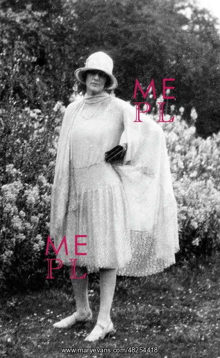 : Fashionable lady posing in garden : Fashionable lady posing in garden