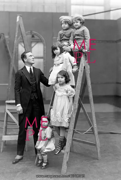 : Father with children on a ladder : Father with children on a ladder