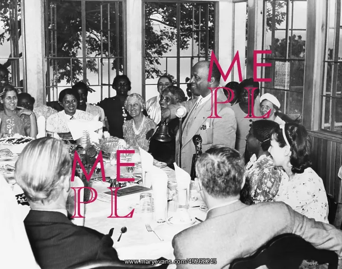 : Father Divine rings the dinner bell calling his : Father Divine rings the dinner bell calling his