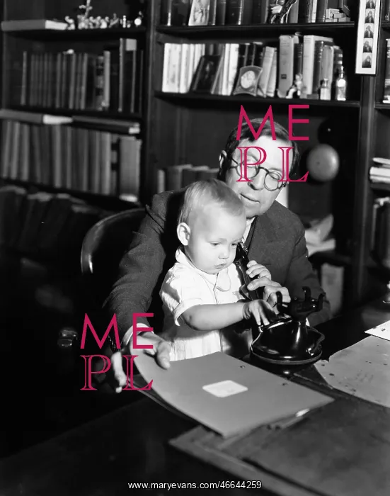: Father helping baby use telephone : Father helping baby use telephone
