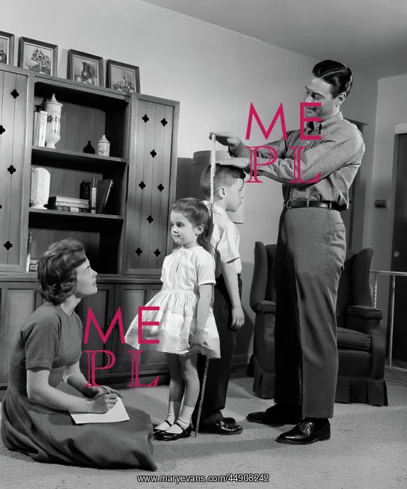 : Father measuring daughter & son back-to-back : Father measuring daughter & son back-to-back