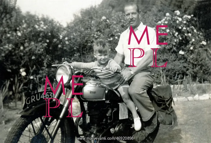 : Father & son on a 1950s BSA motorcycle : Father & son on a 1950s BSA motorcycle