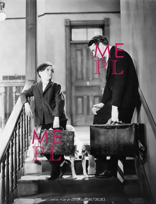 : Father and son travelling with suitcases : Father and son travelling with suitcases