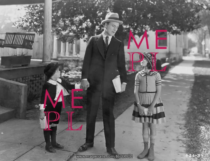 : Father talking to two children outside : Father talking to two children outside
