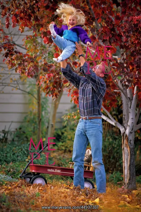 : Father Throwing Laughing Blond Daughter Looking : Father Throwing Laughing Blond Daughter Looking