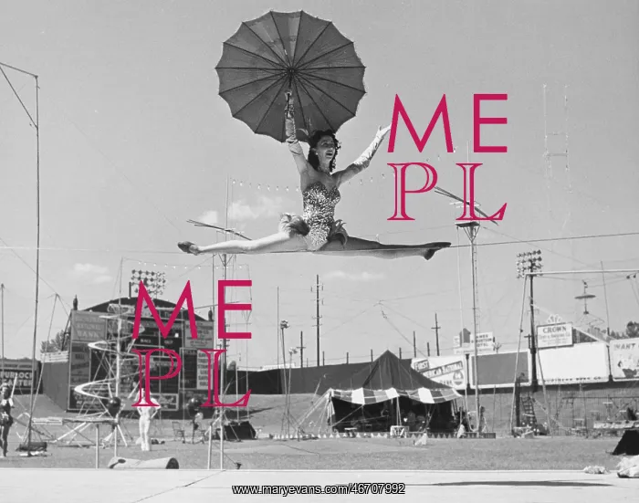 : Female acrobat doing splits on tightrope : Female acrobat doing splits on tightrope