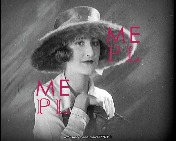 : Female Civilian Modelling A Hat Decorated With : Female Civilian Modelling A Hat Decorated With