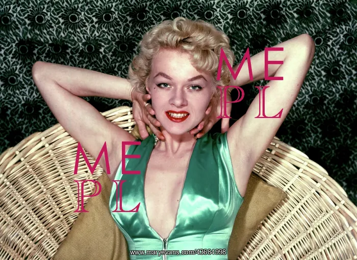 : Female model in a green satin top : Female model in a green satin top