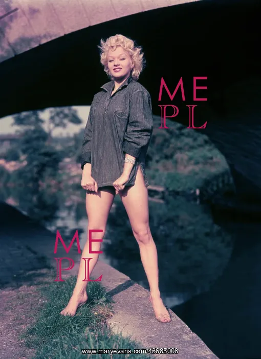 : Female model posing in a grey shirt : Female model posing in a grey shirt