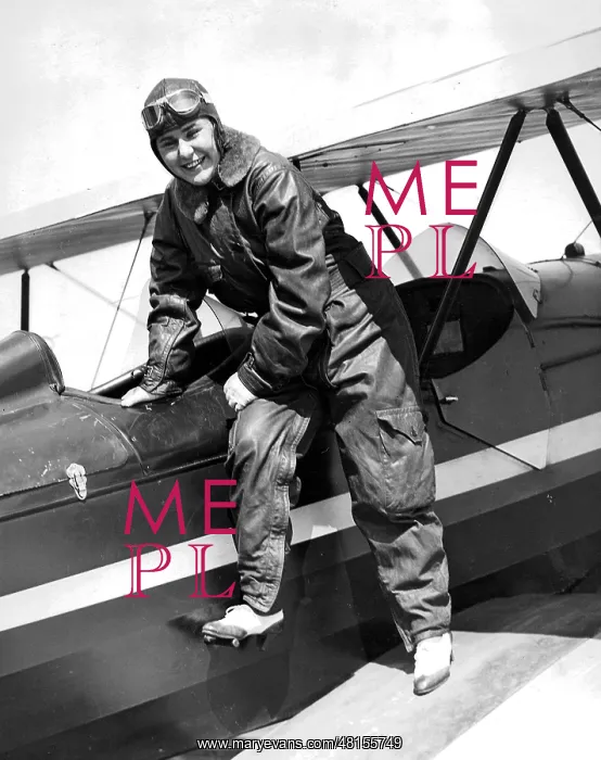 : Female pilot with plane, 1934 : Female pilot with plane, 1934