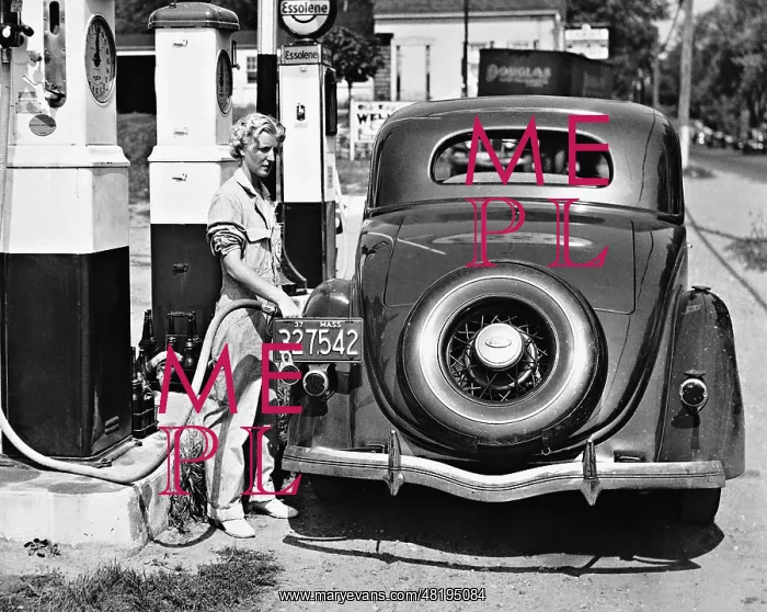 : A female pump attendant, 1937 : A female pump attendant, 1937
