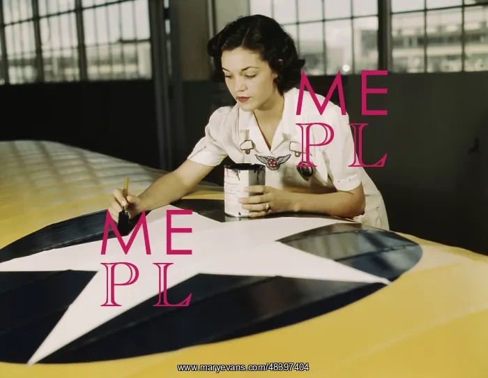 : A female worker paints the American insignia : A female worker paints the American insignia