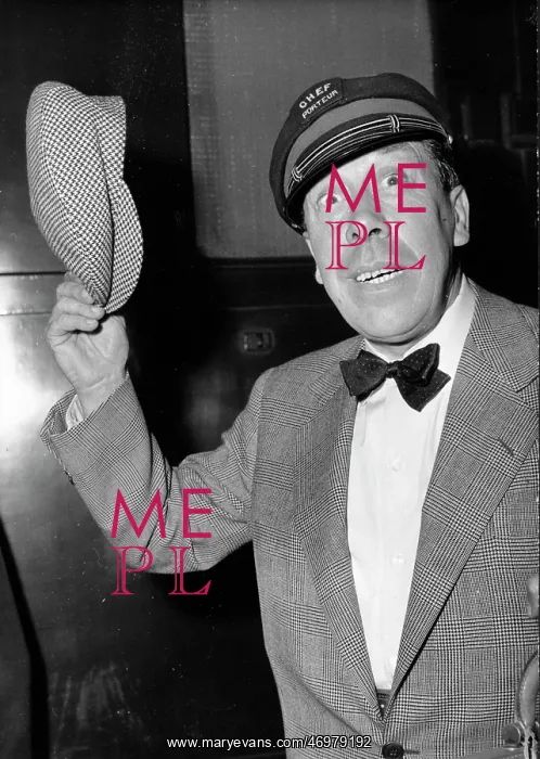 : Fernandel, French comedian, holding a cap : Fernandel, French comedian, holding a cap