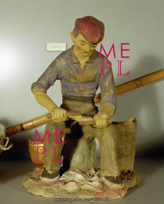 : Figurine depicting a carder : Figurine depicting a carder