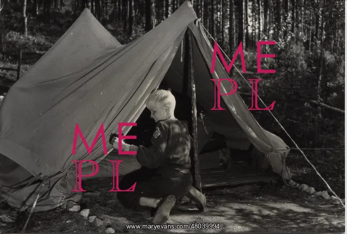 : Finnish boy scout at camp : Finnish boy scout at camp