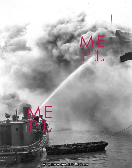 : A fireboat tackling a blaze on the River Thames : A fireboat tackling a blaze on the River Thames