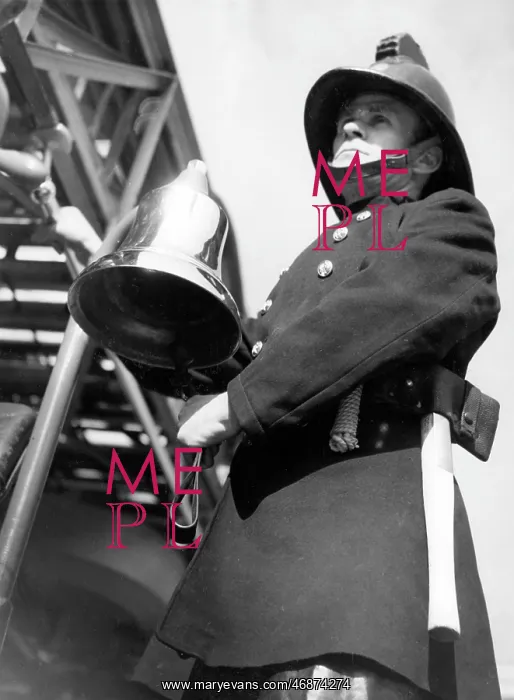  : Firefighter adjusting turntable ladder mechanism