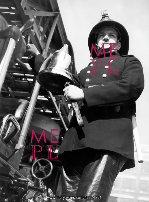 : Firefighter adjusting turntable ladder mechanism : Firefighter adjusting turntable ladder mechanism