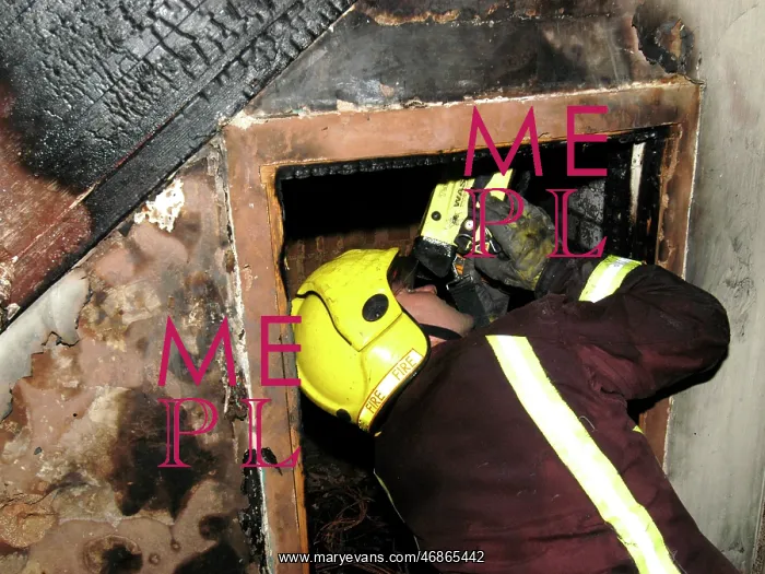 : Firefighter using a thermal imaging camera : Firefighter using a thermal imaging camera