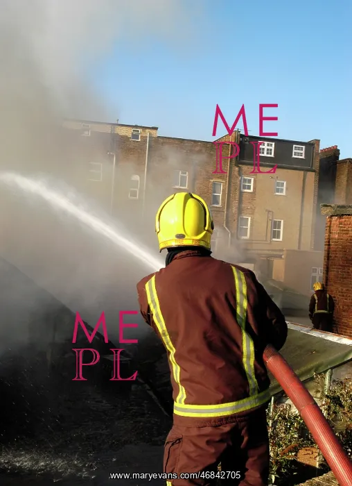 : Firefighter working at scene of fire at New Cross : Firefighter working at scene of fire at New Cross