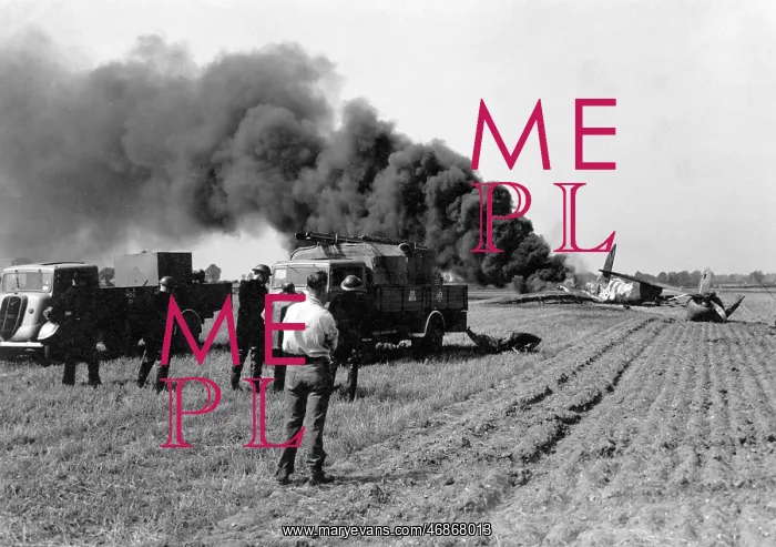 : Firefighters attending crashed plane in field, WW2 : Firefighters attending crashed plane in field, WW2
