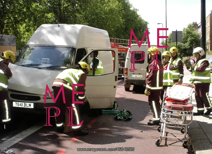 : Firefighters inspecting a broken down Ford transit van : Firefighters inspecting a broken down Ford transit van