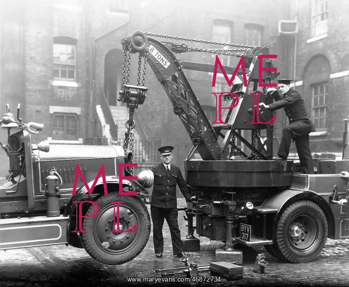 : Firefighters operating a Dennis breakdown lorry : Firefighters operating a Dennis breakdown lorry