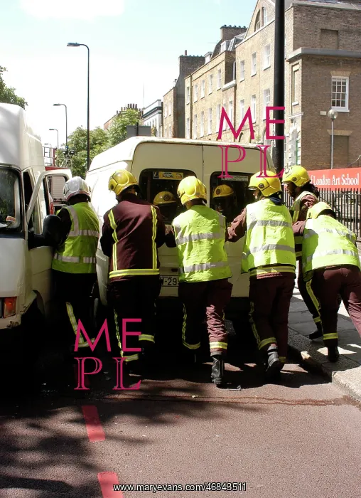 : Firefighters pushing a broken down Ford transit van : Firefighters pushing a broken down Ford transit van