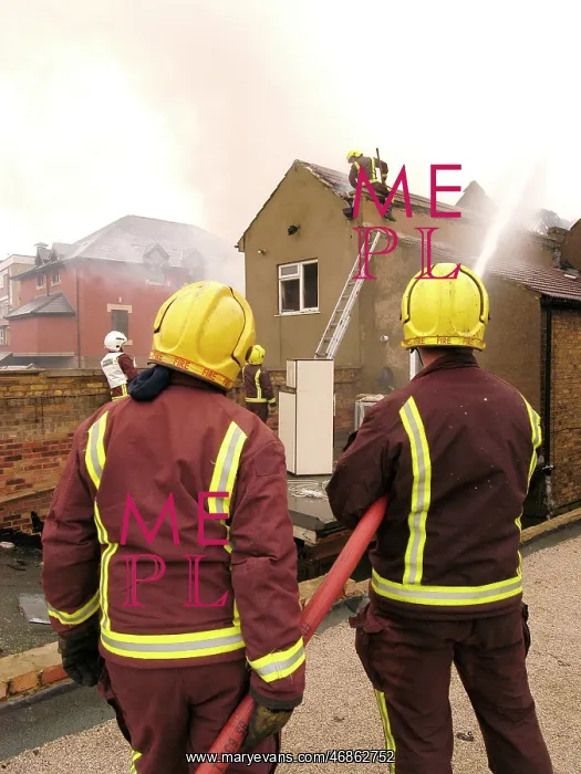 : Firefighters at the scene of an explosion : Firefighters at the scene of an explosion