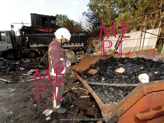 : Firefighters at the scene of an industrial fire : Firefighters at the scene of an industrial fire