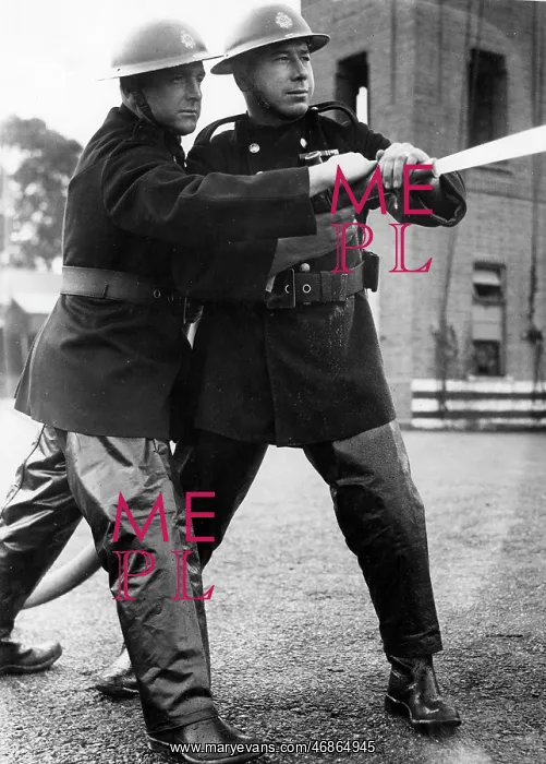 : Firefighters taking part in a hose training drill, WW2 : Firefighters taking part in a hose training drill, WW2