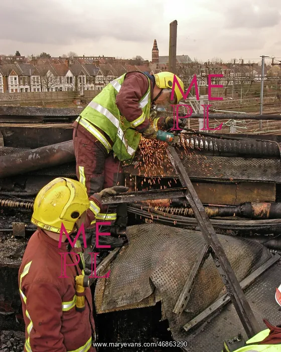 : Firefighters using cutting equipment, West London : Firefighters using cutting equipment, West London