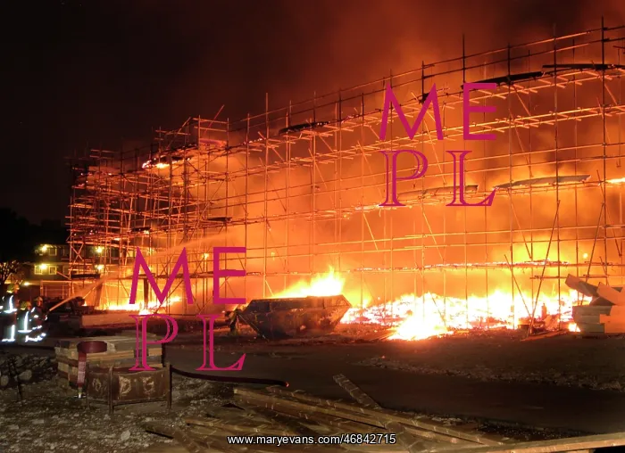 : Firefighters working at fire on building site : Firefighters working at fire on building site