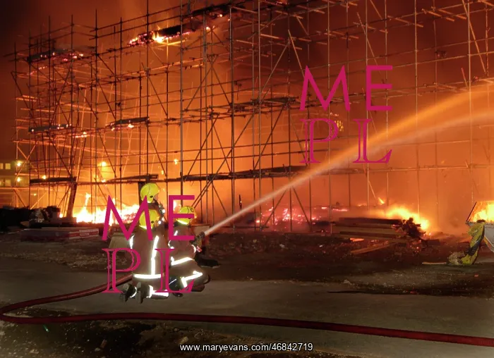 : Firefighters working at fire on building site : Firefighters working at fire on building site